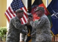 The head of US Central Command and the top US commander of coalition forces in Afghanistan take part in an official handover ceremony in Kabul on 12 July 2021 (AFP)